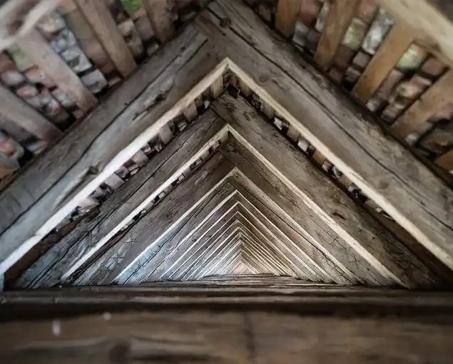 View looking down a rustic loft.
